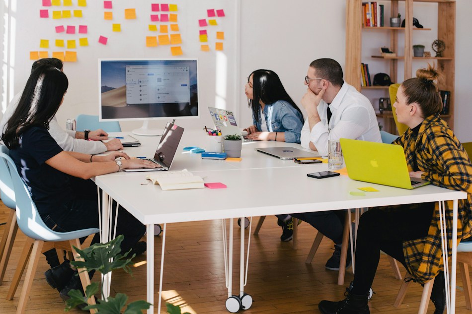 Team planning a strategy at a whiteboard